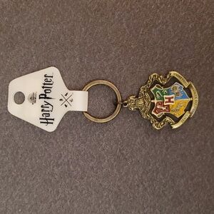 NWT Harry Potter metallic pivotal keychain. Four houses. From NYC store.